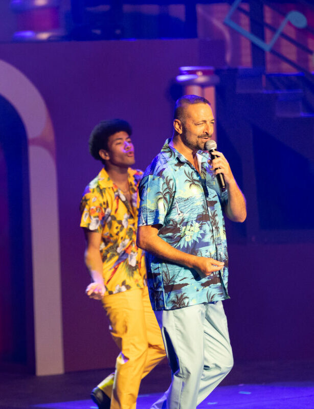 two male singers in Hawaiian shirts
